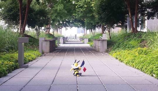 GT Bee Mascot holding a french flag